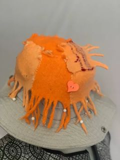 Hand woven then felted.Octopus hat