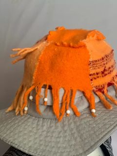 Hand woven then felted.Octopus hat